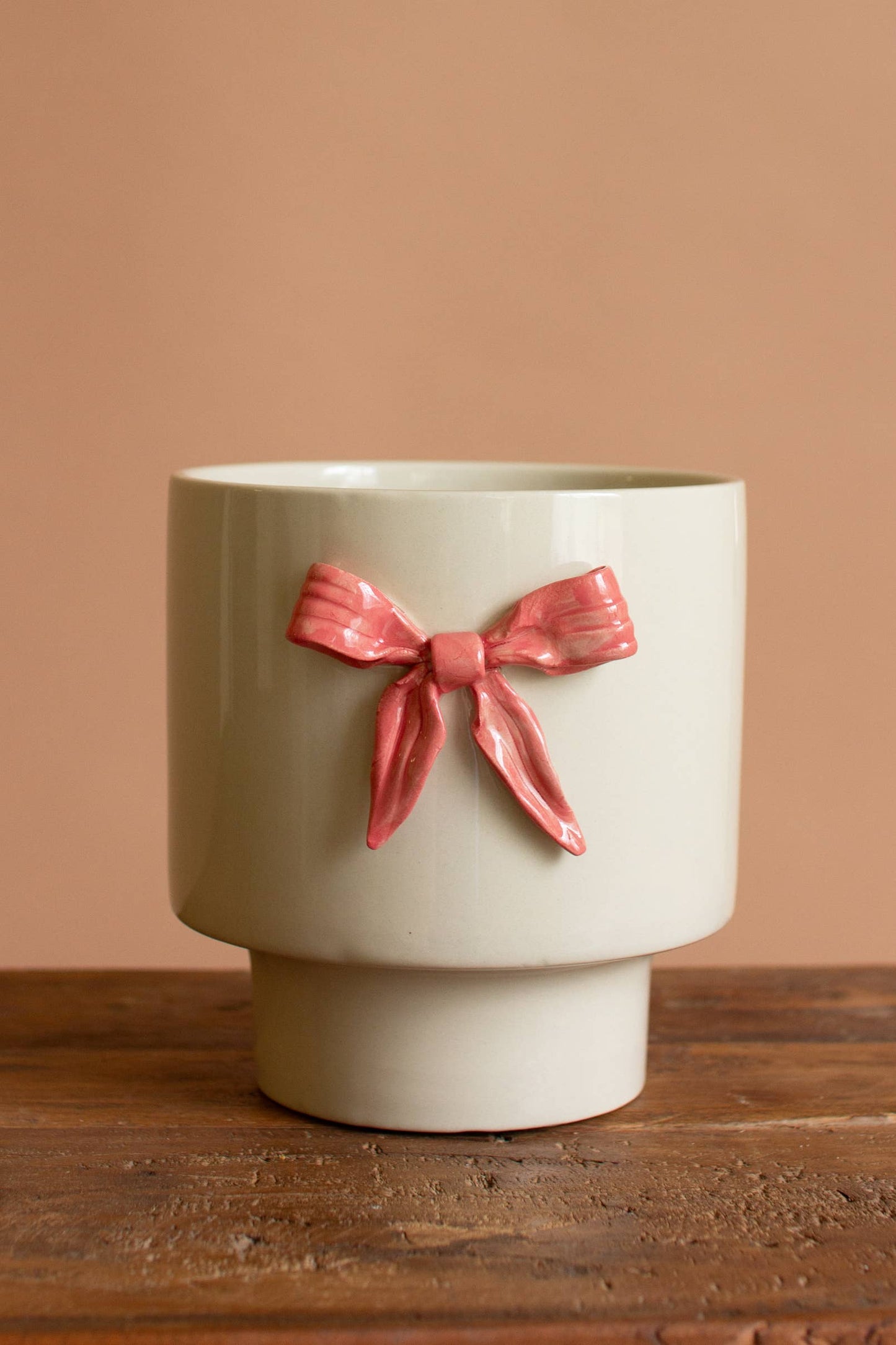 CERAMIC FLOWER POT WITH PINK BOW