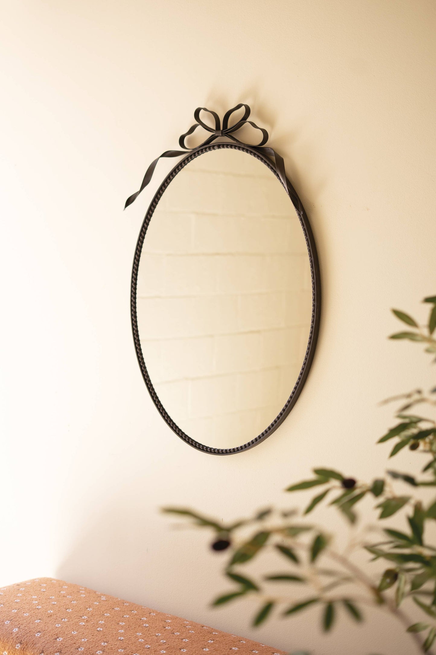 METAL FRAMED OVAL MIRROR - BOW DETAIL